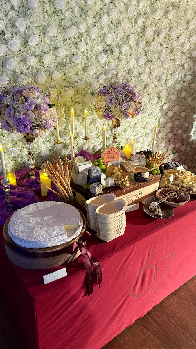 Floral arrangement purple yellow food serving display event decoration