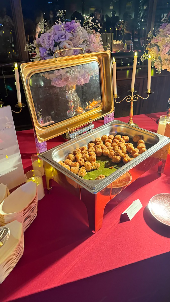 Gold frame buffet display purple flowers candelabra corporate event catering