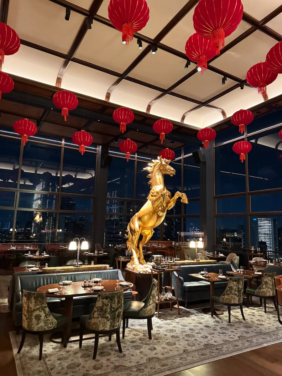 Gold horse centrepiece red lanterns Chinese New Year corporate dinner Singapore