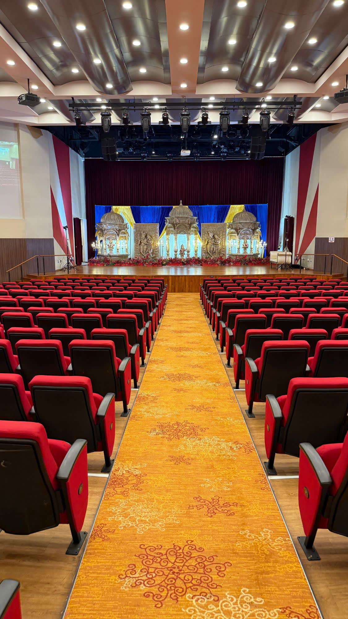 Blue and gold draping with domes and Radha Krishna panels