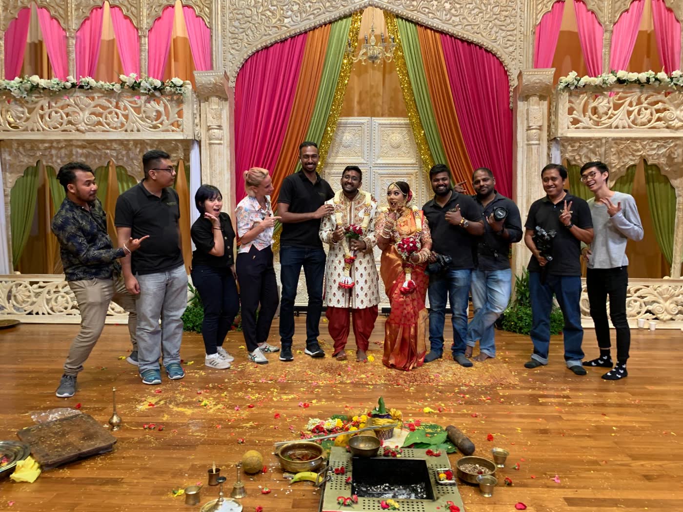 Our team with a couple on a carved ivory stage